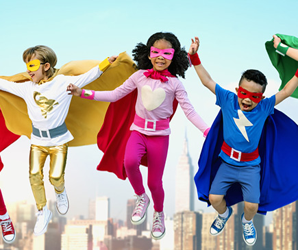 Kids dressed as superheroes and leaping in the air